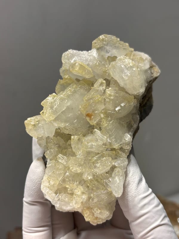 Plate of pale yellow baryte crystals from Jinkouhe, Sichuan, China, reverse side
