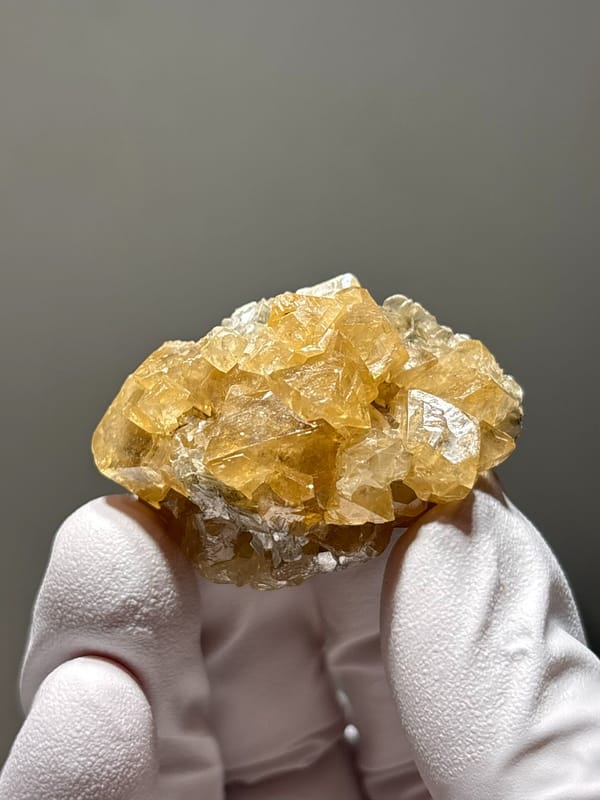 Golden scheelite cluster of intergrown crystals from Xuebaoding, Sichuan, China, second angle
