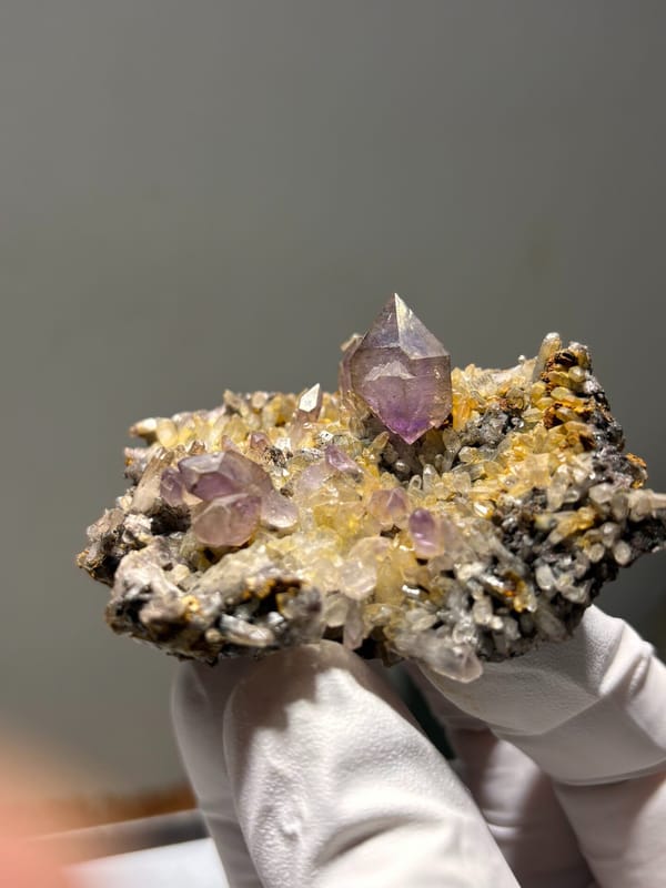 Purple amethyst points on druse plate from Zimbabwe, second angle