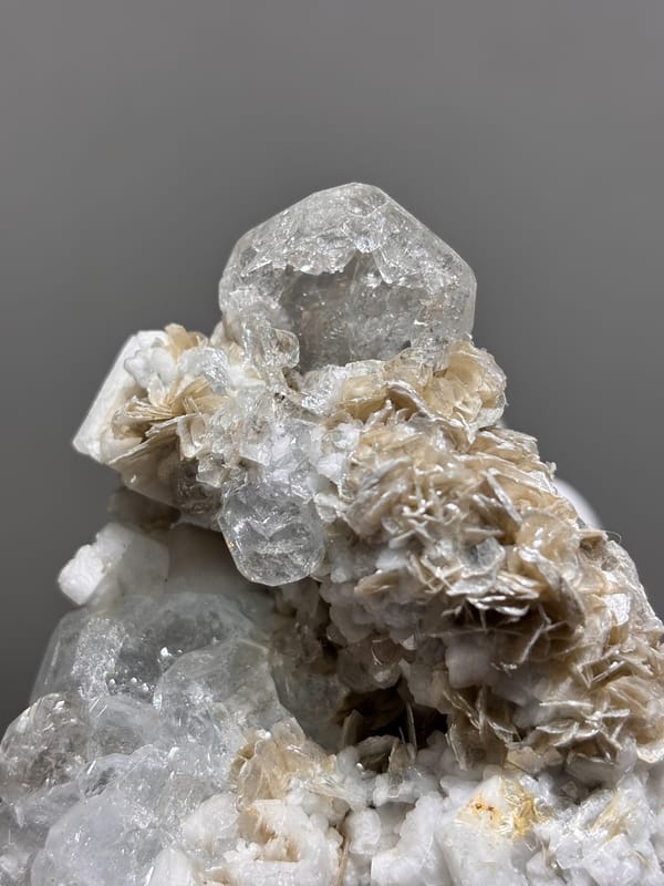 Etched hollowed aquamarine on mica and feldspar from Xuebaoding, Sichuan, China