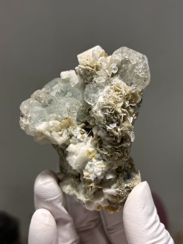 Etched hollowed aquamarine on mica and feldspar from Xuebaoding, Sichuan, China, second angle