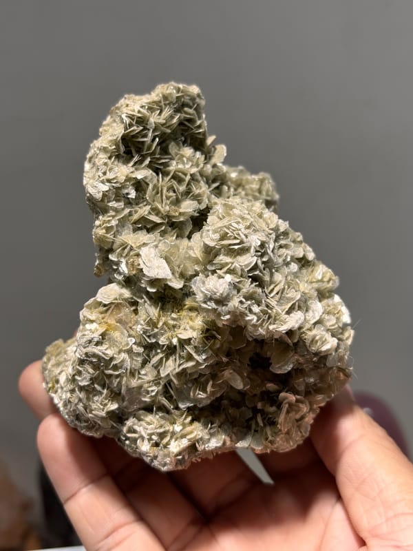 Dome of tan mica rosettes with scheelite from Xuebaoding, Sichuan, China, second angle