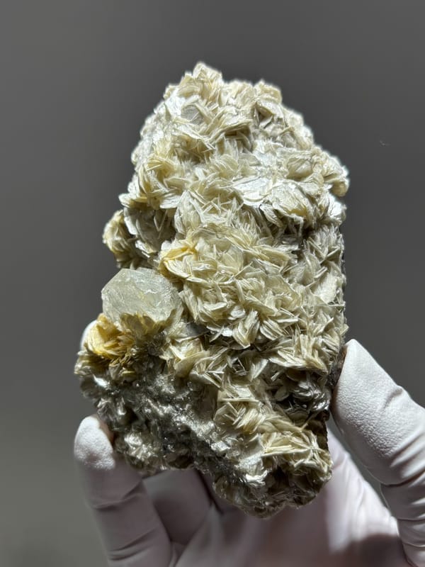 Pale aquamarine nestled in mica block from Xuebaoding, Sichuan, China, close-up of the crystal faces