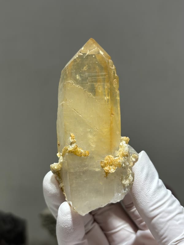 Golden quartz prism with mica base from Xuebaoding, Sichuan, China, close-up of the crystal faces