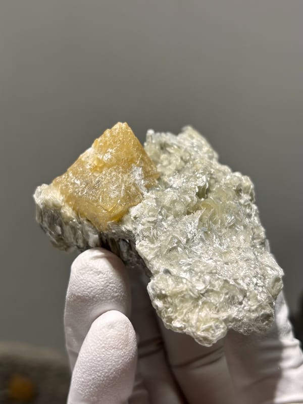 Honey scheelite on silvery mica plate from Xuebaoding, Sichuan, China, second angle