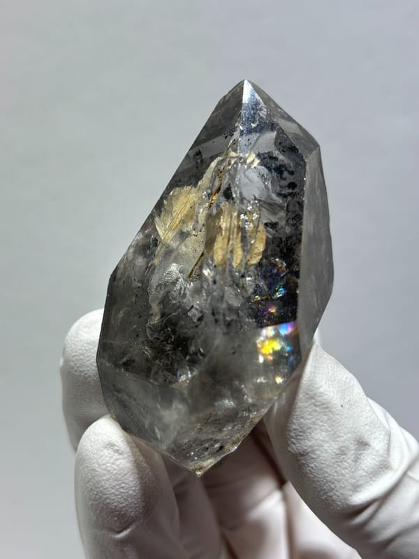 Clay skeletal quartz floater with rainbow flashes from Guizhou, China, second angle