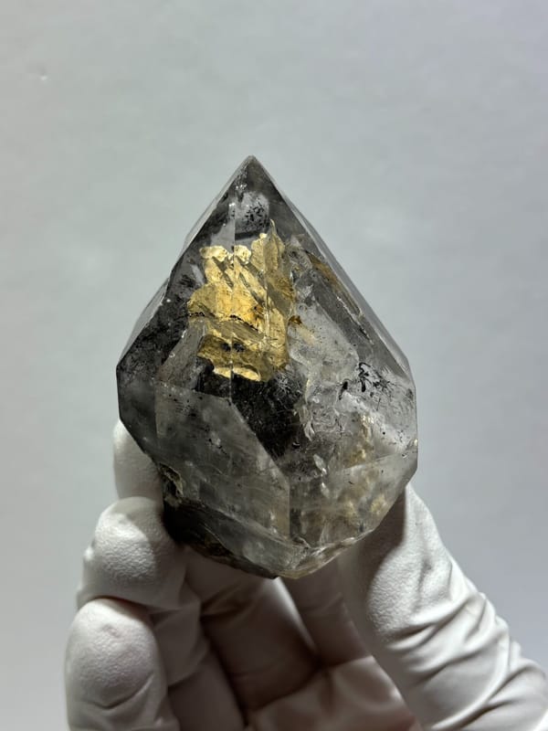Clay skeletal quartz floater with rainbow flashes from Guizhou, China, reverse side