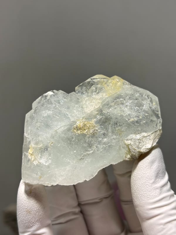 Pale green aquamarine block with golden patch from Xuebaoding, Sichuan, China, second angle