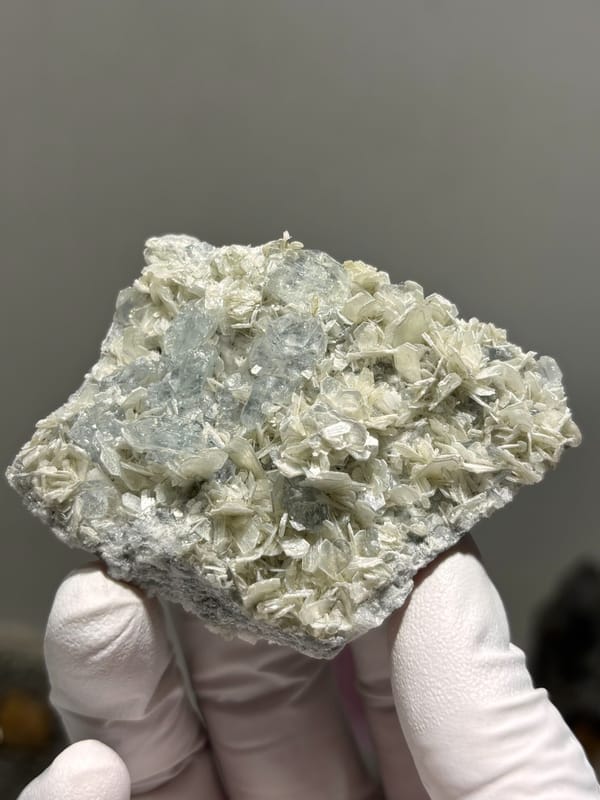 Two-sided pale aquamarine in mica-feldspar plate from Xuebaoding, Sichuan, China, second angle