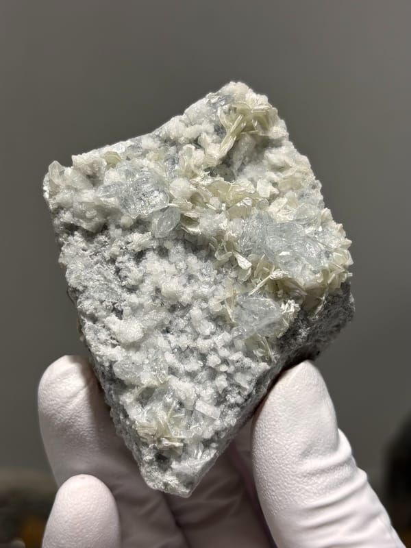 Two-sided pale aquamarine in mica-feldspar plate from Xuebaoding, Sichuan, China, reverse side