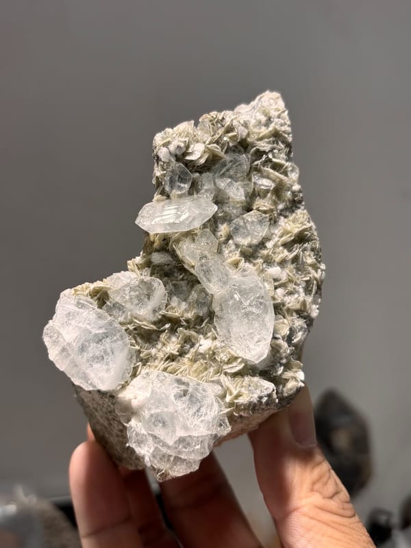 Grey mica plate with pale aquamarine crystals from Xuebaoding, Sichuan, China, reverse side