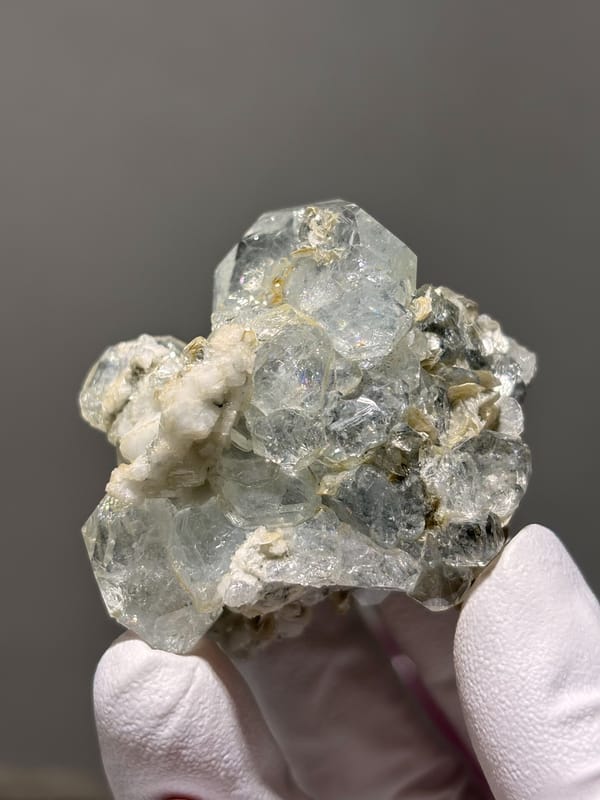 Pale blue aquamarine over white mica and feldspar from Xuebaoding, Sichuan, China, top view