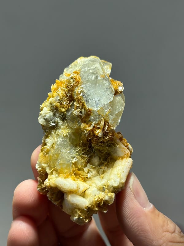 Two-sided aquamarine plate with golden mica and feldspar from Xuebaoding, Sichuan, China, close-up of the crystal faces
