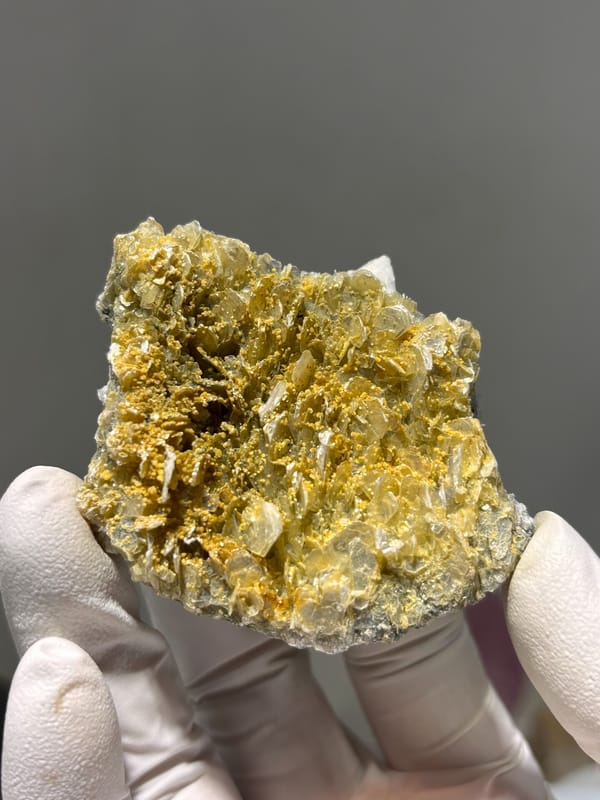 Pale aquamarine cluster over white feldspar and mica from Xuebaoding, Sichuan, China, top view