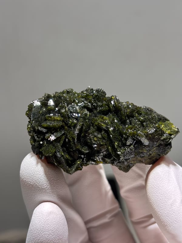 Large-grained epidote floater cluster from Sichuan, China, close-up of the crystal faces