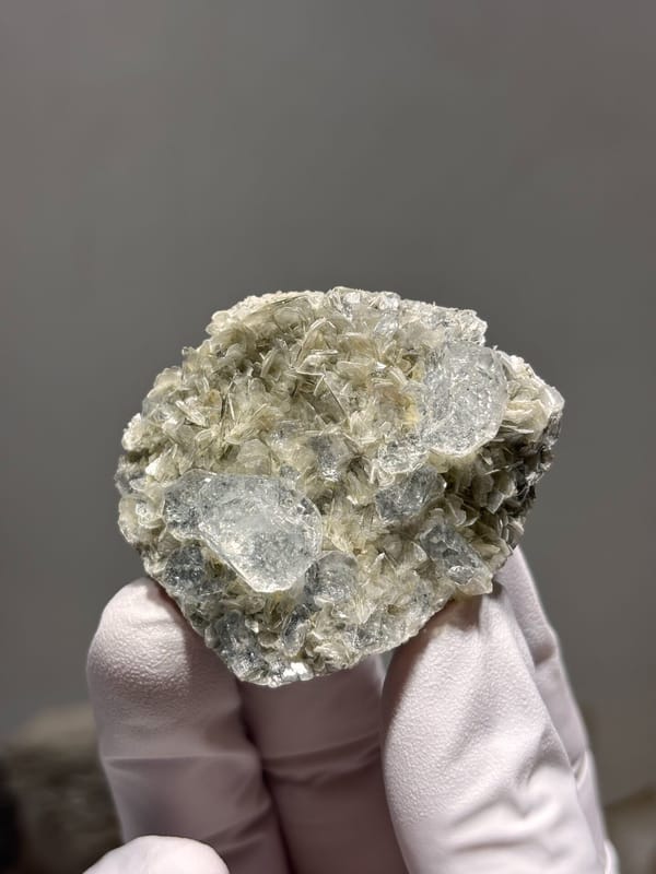 Aquamarine plate on mica from Xuebaoding, Sichuan, China, close-up of the crystal faces