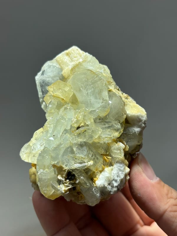 Yellow-green aquamarine crystals with cassiterite and feldspar from Xuebaoding, Sichuan, China, second angle