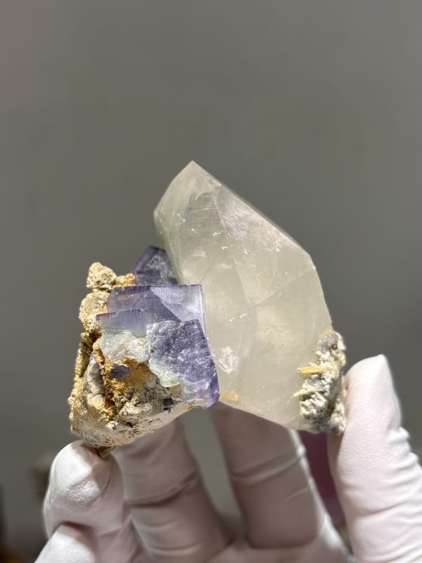 Clear quartz point with purple fluorite cube from Yaogangxian, Hunan, China, second angle