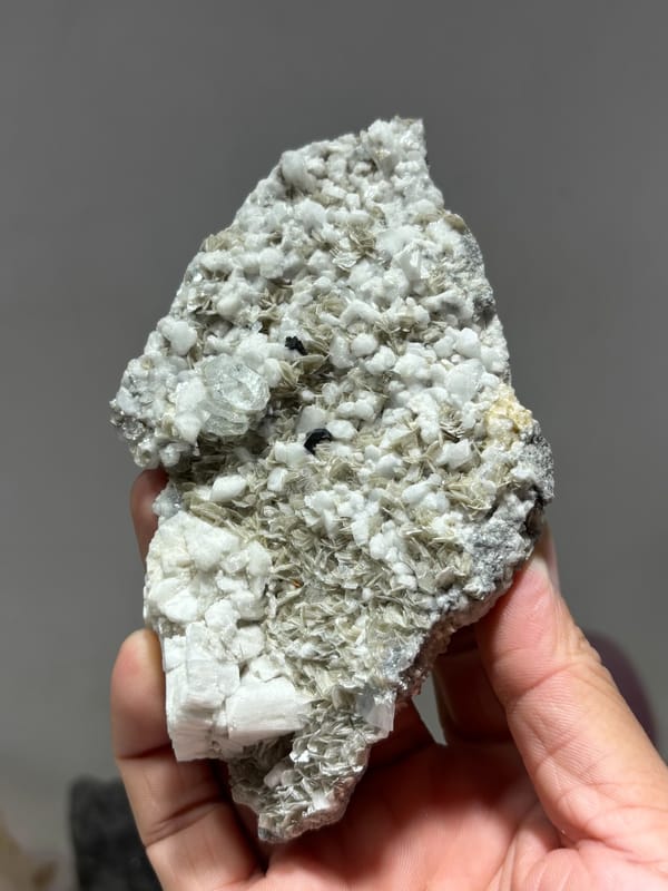 Plate of mica and feldspar with aquamarine and cassiterite from Xuebaoding, Sichuan, China, second angle