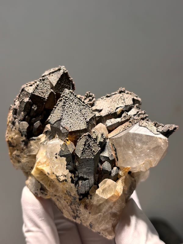 Madagascan quartz cluster with hematite-coated tips, reverse side