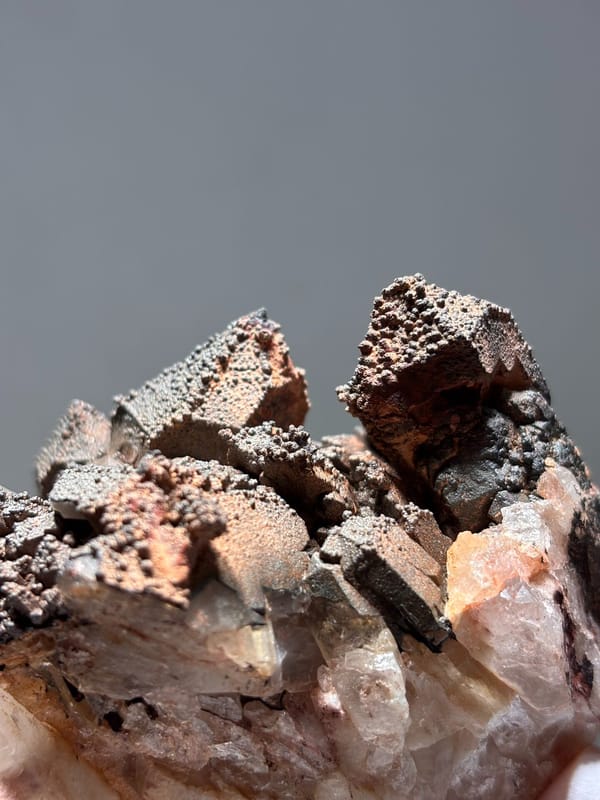 Madagascan quartz cluster with hematite-coated tips, top view