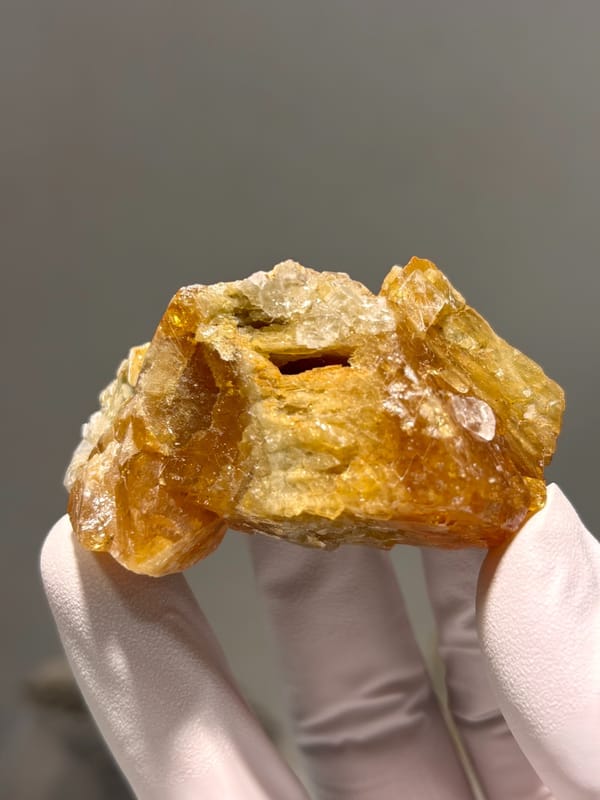 Orange scheelite floater from Xuebaoding, Sichuan, China, top view