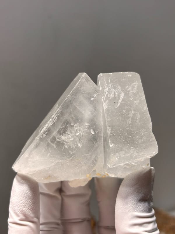 Clear baryte crystal group from Jinkouhe, Sichuan, China, detail of the matrix contact