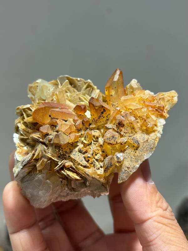 Golden-stained quartz on mica with aquamarine from Xuebaoding, Sichuan, China, second angle