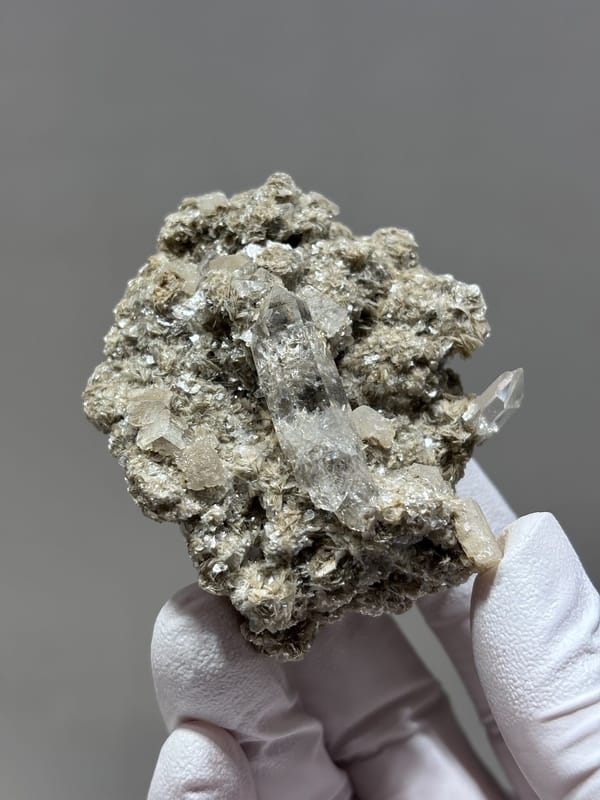 Clear quartz point in mica and calcite matrix from Xuebaoding, Sichuan, China, second angle
