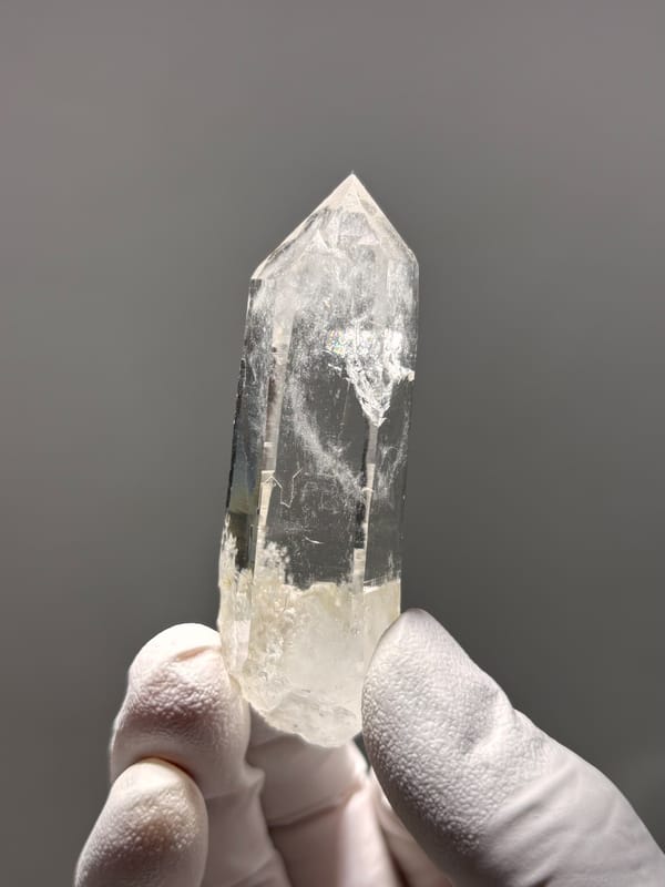 Bright clear quartz point with chlorite base from Xuebaoding, Sichuan, China, second angle