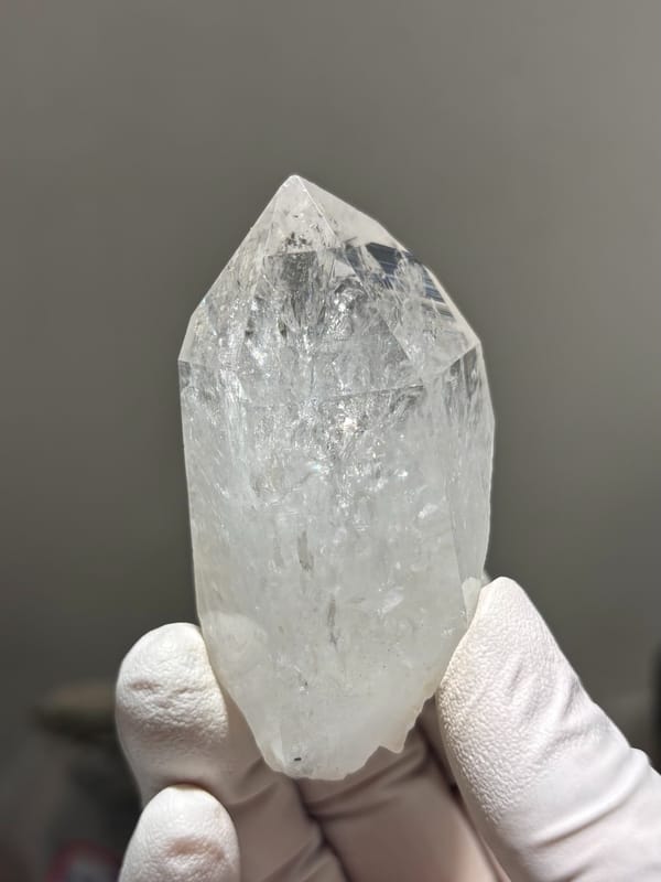 Icy clear quartz point with rainbow flash from Jinkouhe, Sichuan, China, second angle