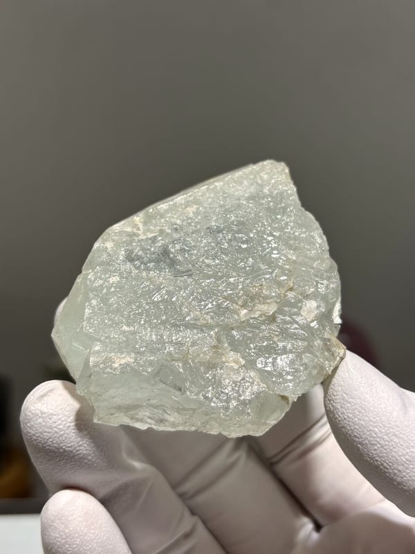 Frosted pale aquamarine tablet from Xuebaoding, Sichuan, China, reverse side