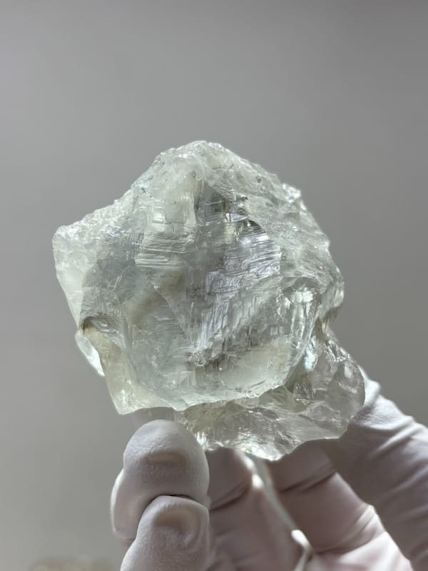 Colourless fluorite octahedron from Xuebaoding, Sichuan, China, reverse side