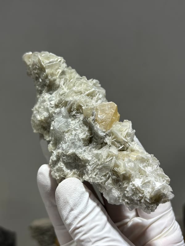 Mica plate with orange scheelite crystal from Xuebaoding, Sichuan, China, second angle