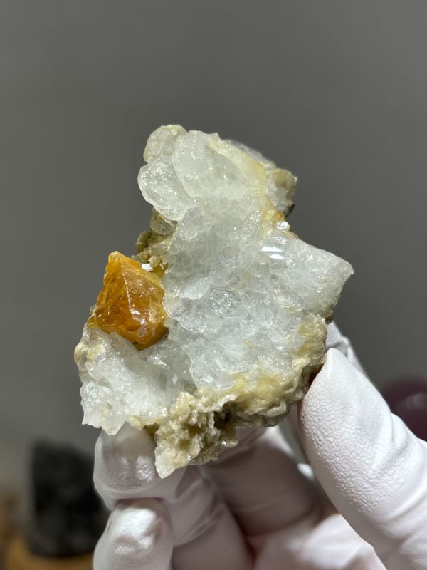 Pale aquamarine cluster with orange scheelite crystal from Xuebaoding, Sichuan, China, second angle