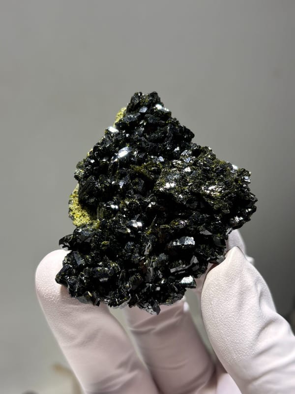 Dark green epidote cluster from Turkey, close-up of the crystal faces