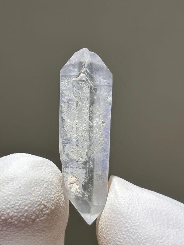 Tiny dumortierite-in-quartz double-terminated crystal from Brazil, side view