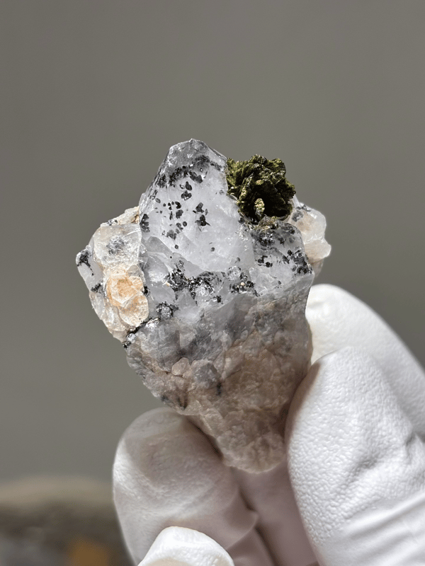 Garden quartz with ball of green epidote from Sichuan, China, close-up of the crystal faces