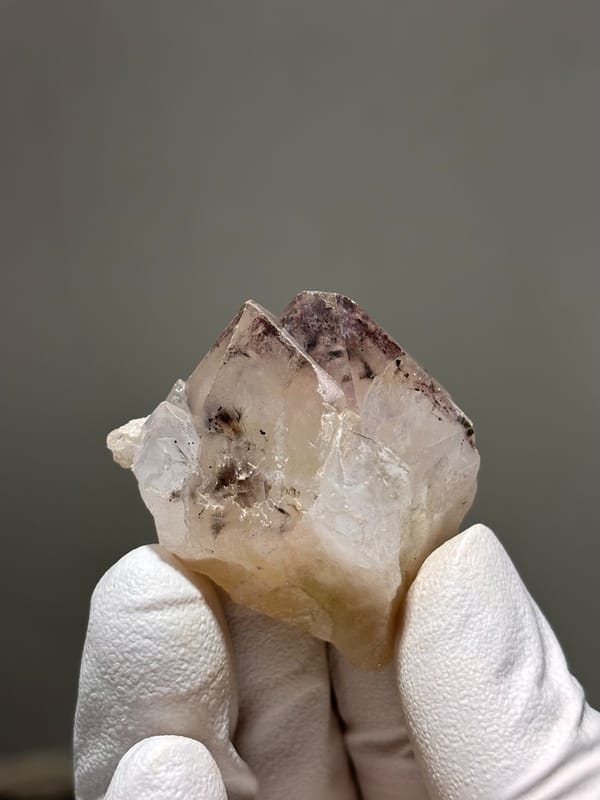 Garden quartz with dark inclusions and rainbow flash from Sichuan, China, reverse side