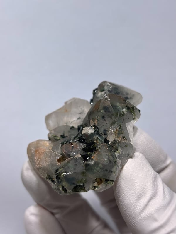 Garden quartz cluster with green inclusions from Sichuan, China, close-up of the crystal faces