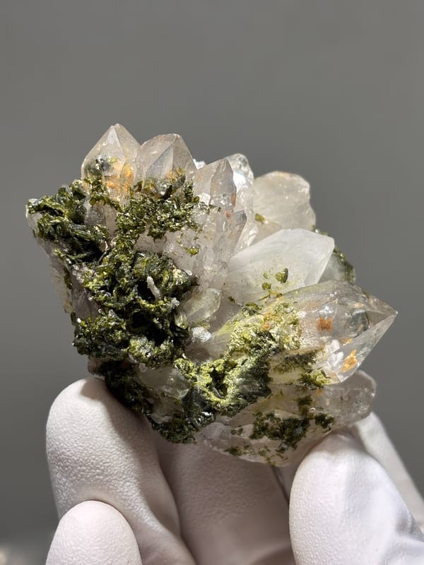 Garden quartz cluster with epidote and orange inclusions from Sichuan, China, reverse side