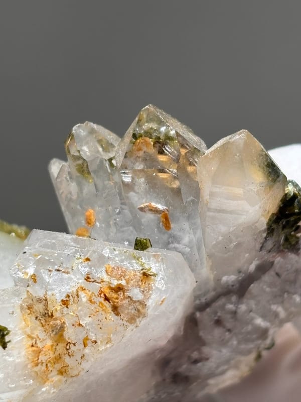Garden quartz cluster with epidote and orange inclusions from Sichuan, China, top view