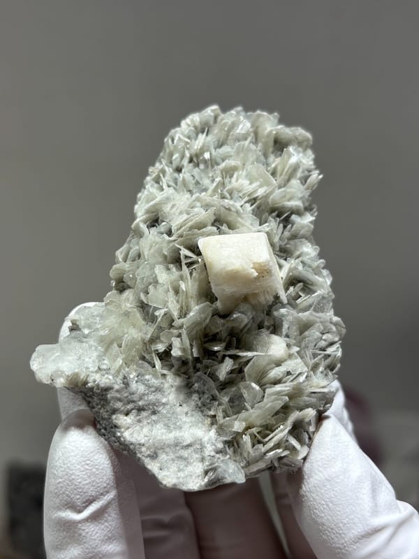 Pale mica plate with feldspar and hidden aquamarine from Xuebaoding, Sichuan, China, second angle