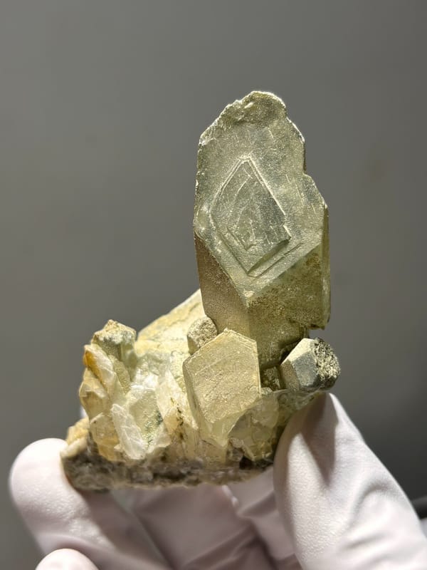 Green phantom quartz cluster from Sichuan, China, close-up of the crystal faces