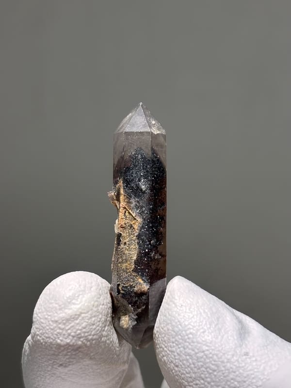 Slender red phantom quartz wand from Brazil, top view