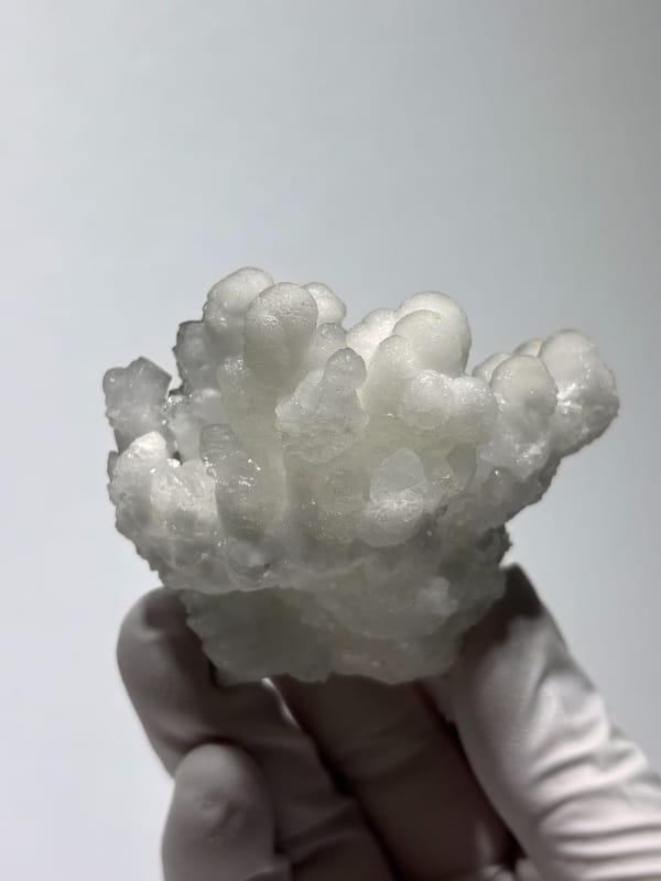 Grey botryoidal hydrozincite cluster from Yunnan, China, reverse side