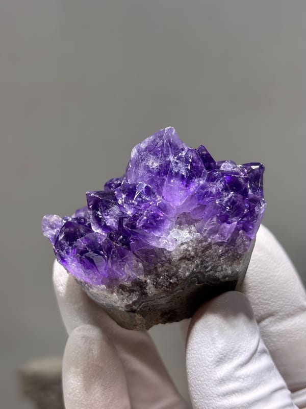 Deep purple amethyst cluster on sawn base from Brazil, reverse side