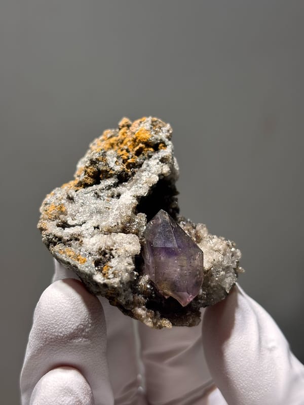 Purple amethyst point on druse matrix from Zimbabwe, second angle