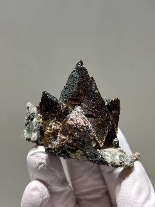 Dark brown helvine crystal group from Inner Mongolia, China, top view