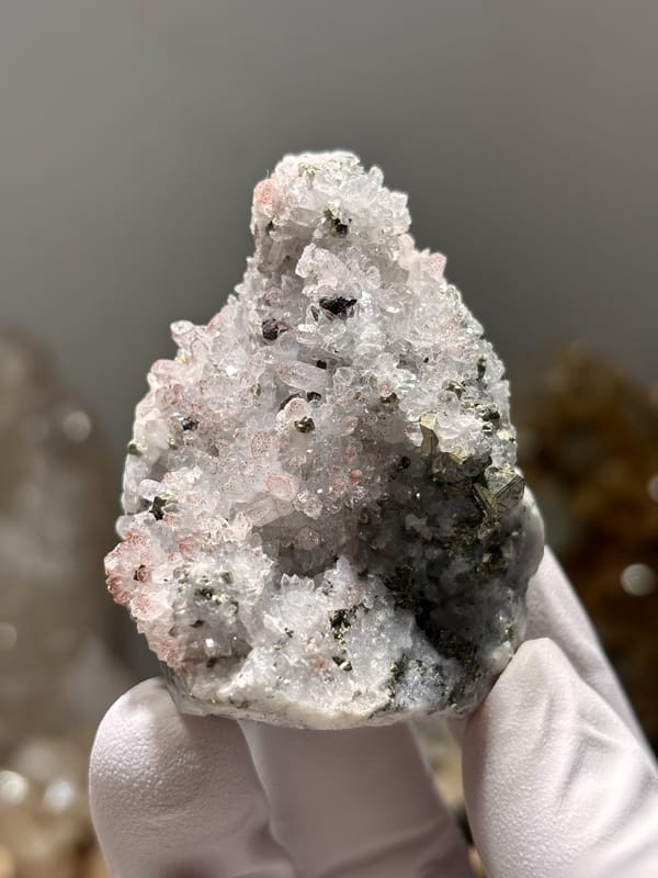 Pink-skinned quartz druse with pyrite from Jiangxi, China, second angle